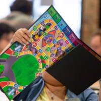 person opening board game